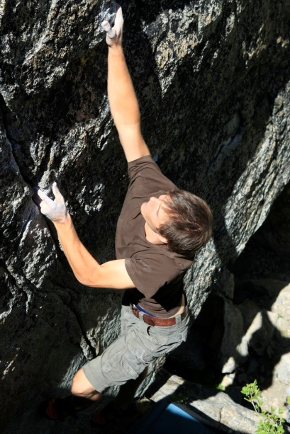 Free climber rock climbing without protective equipment