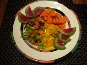 The dinner is served with a garden salad with watermelon radishes, carrots, yellow bell pepper and celery. The Salad dressing is balsamic vinegar and cold pressed organic olive oil.